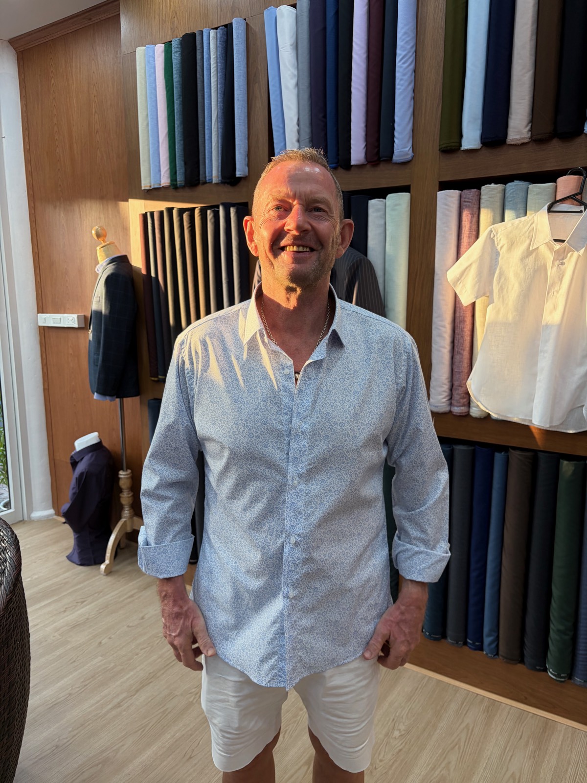 Client in a light blue floral shirt