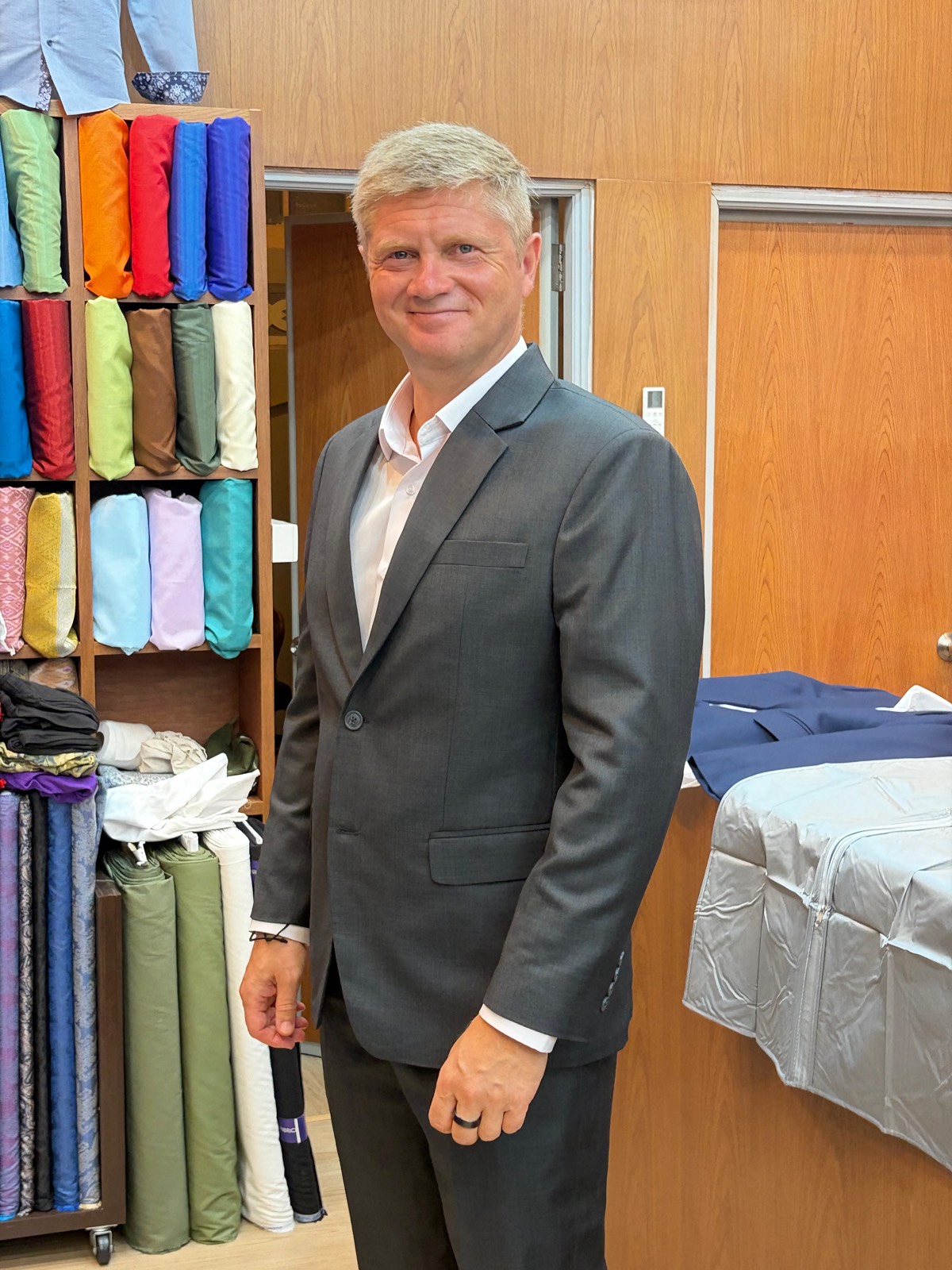 Client at a grey suit fitting