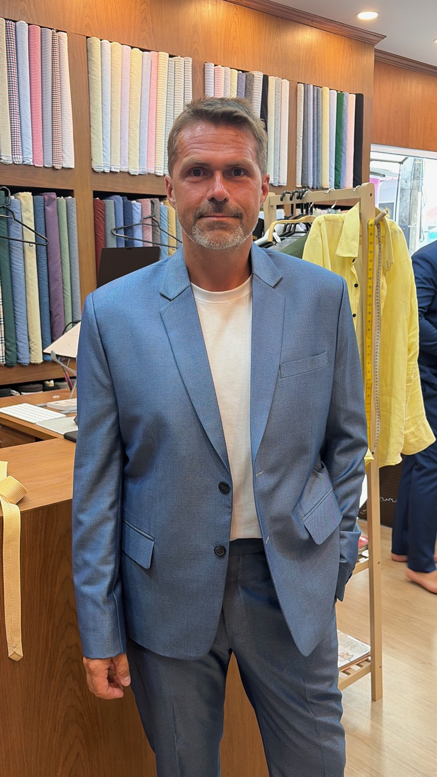 Client in a light blue suit