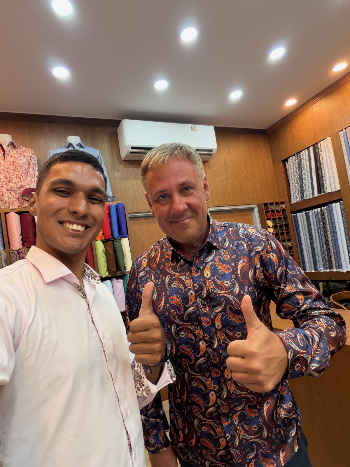 Client and tailor with a custom paisley print shirt