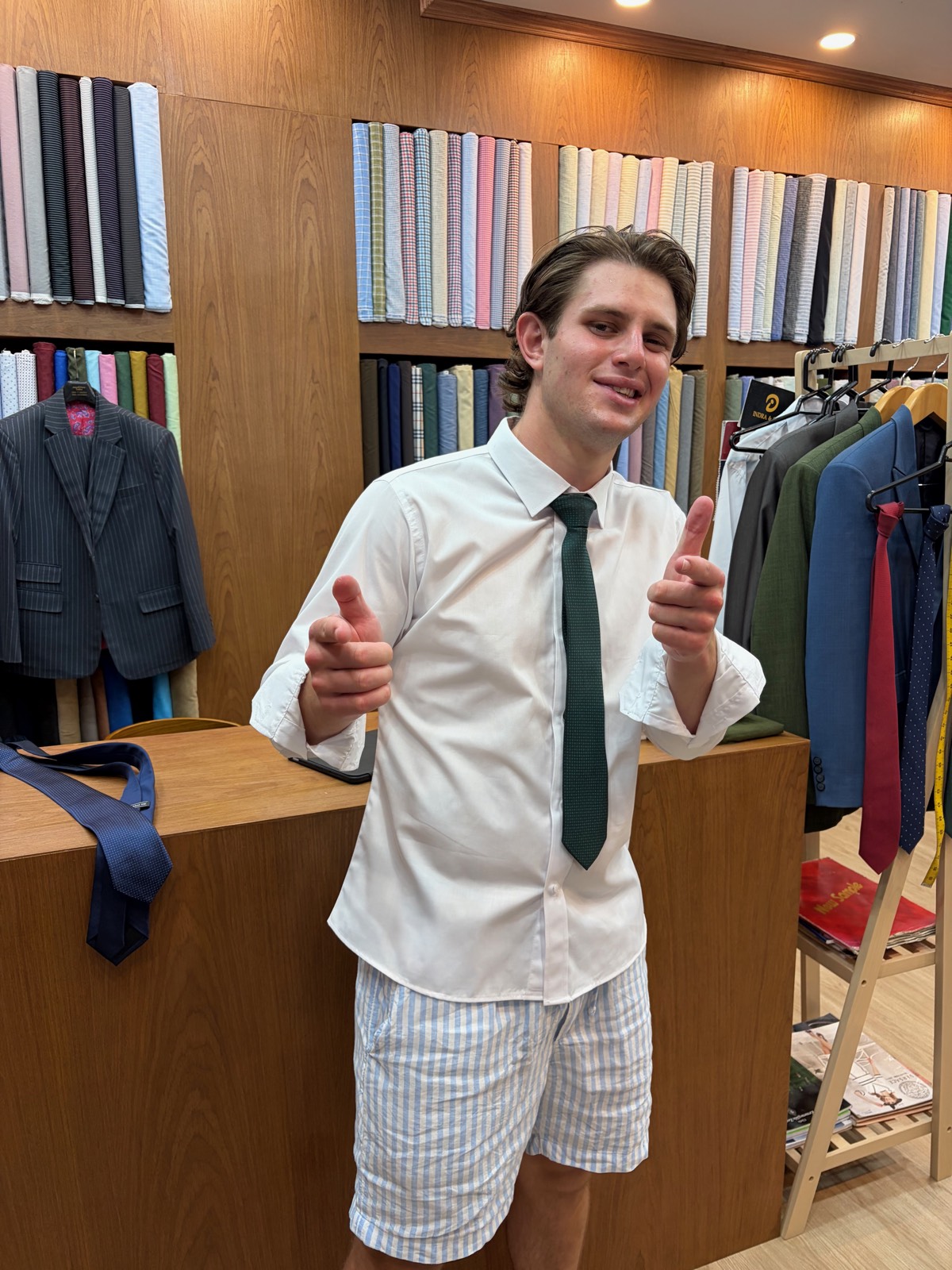 Client in a white shirt with green tie